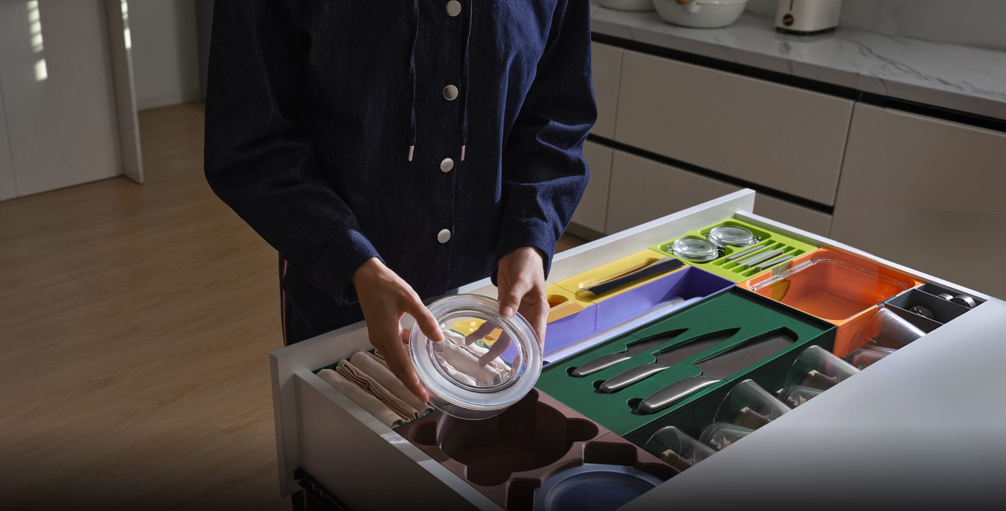 Custom 3D printed drawer organizers in bright colors for kitchen and home organization